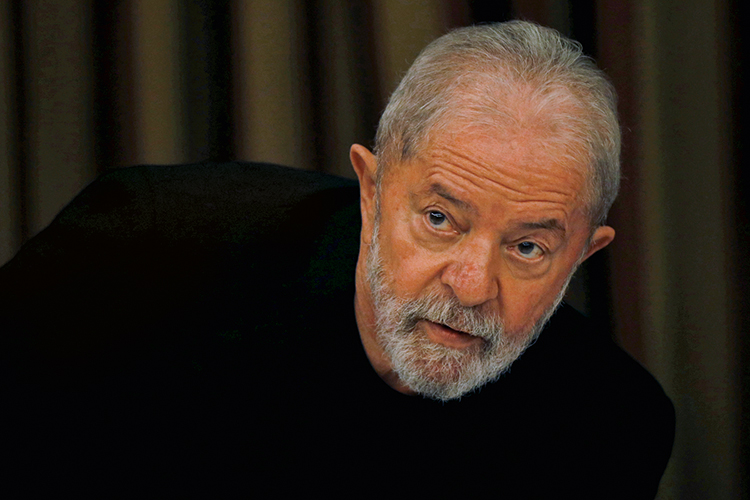 Brazil&rsquo;s former President Luiz Inacio Lula da Silva looks on during a meeting with members of the Workers Party (PT) in Brasilia