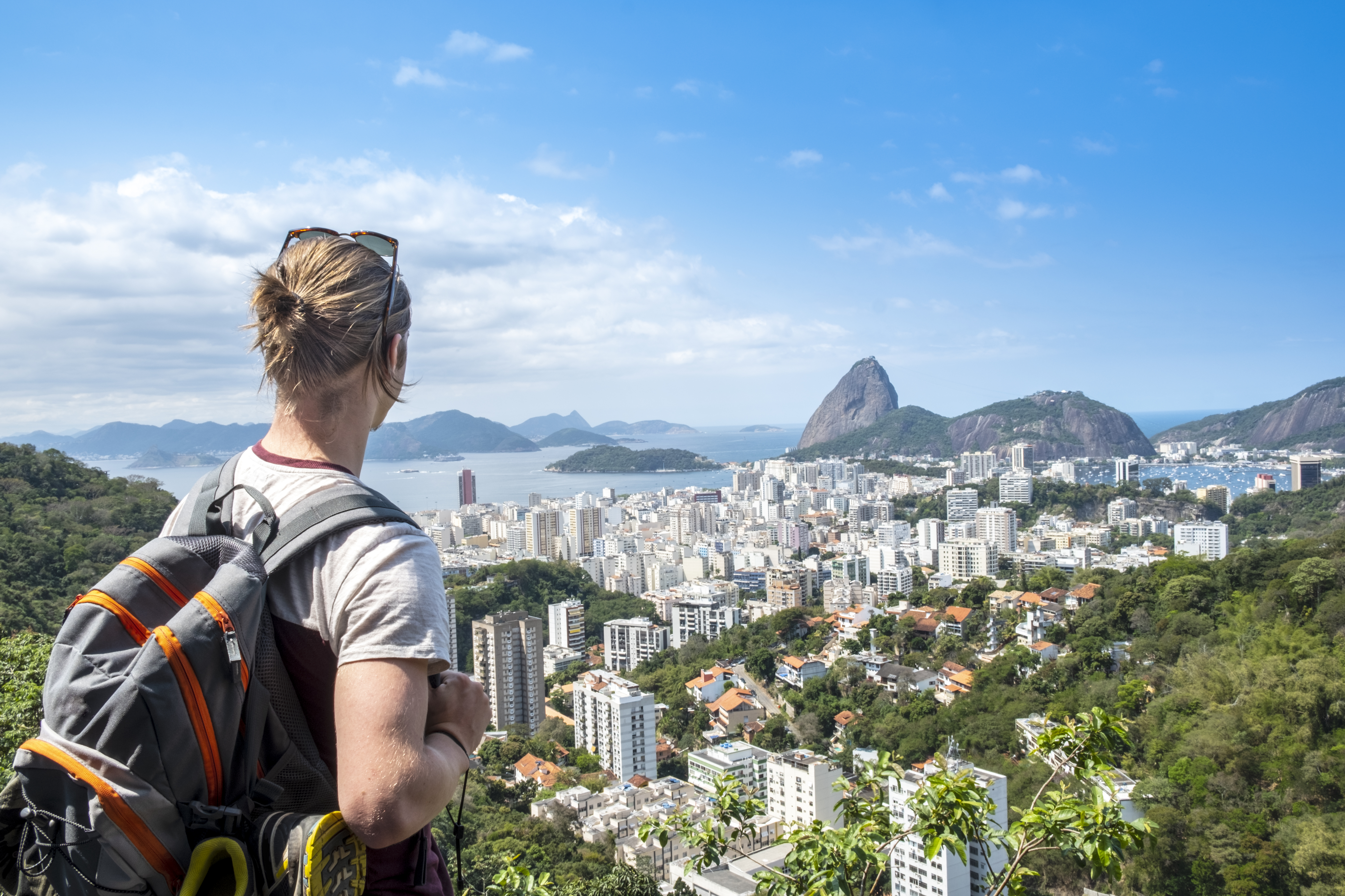 A young man taking shots of the Rio de Janeiro skyline