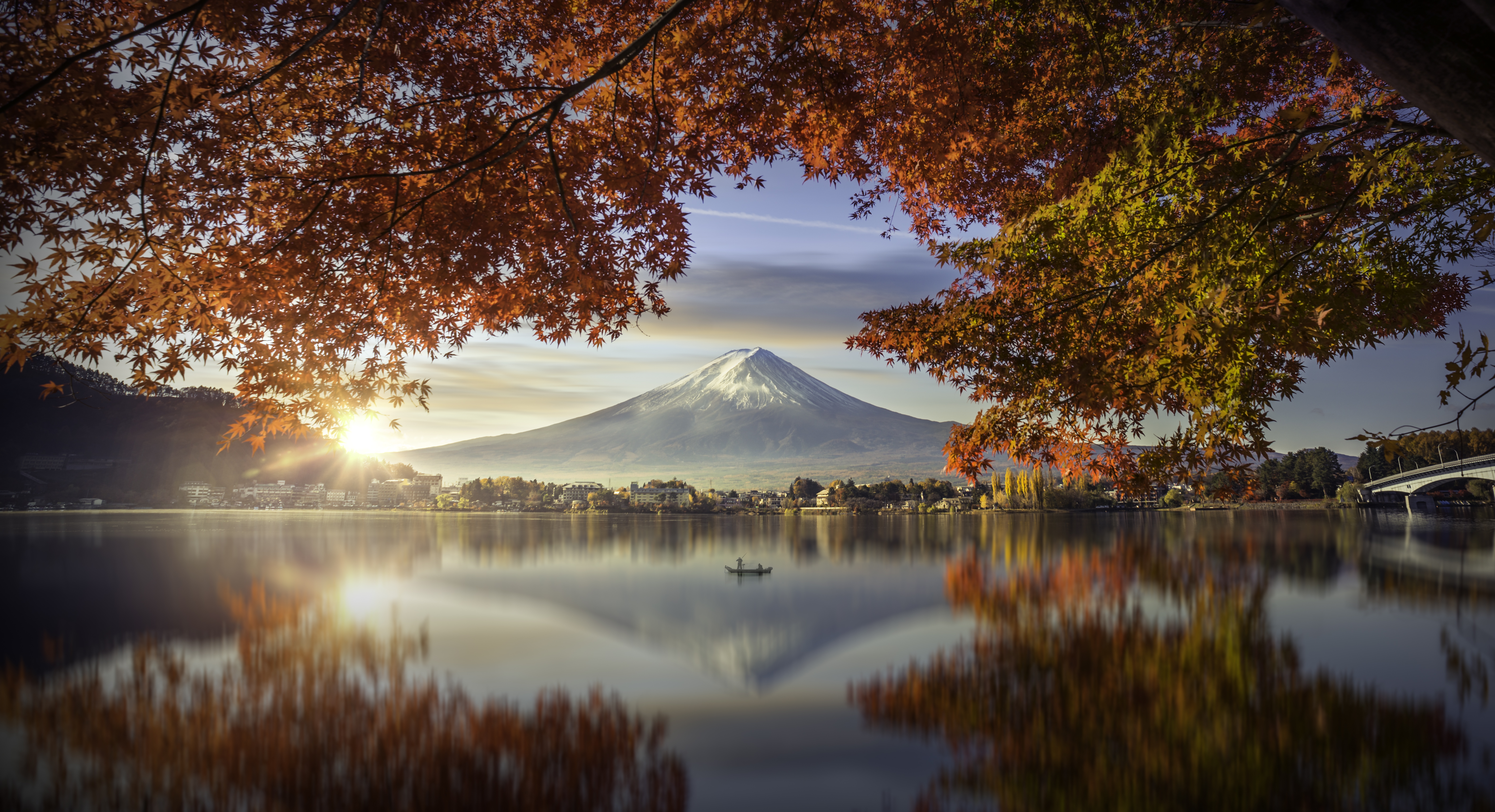 Colorful Autumn Season and Mountain Fuji with morning fog and red leaves at lake Kawaguchiko is one of the best places in Japan