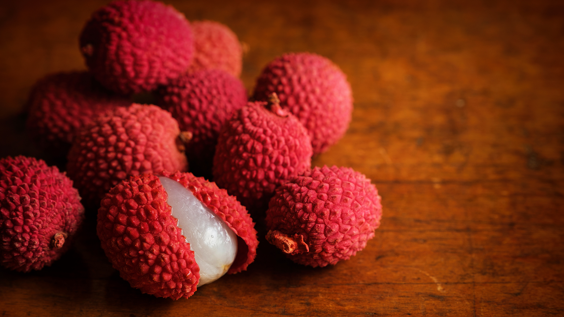 Organic lychee on wooden table