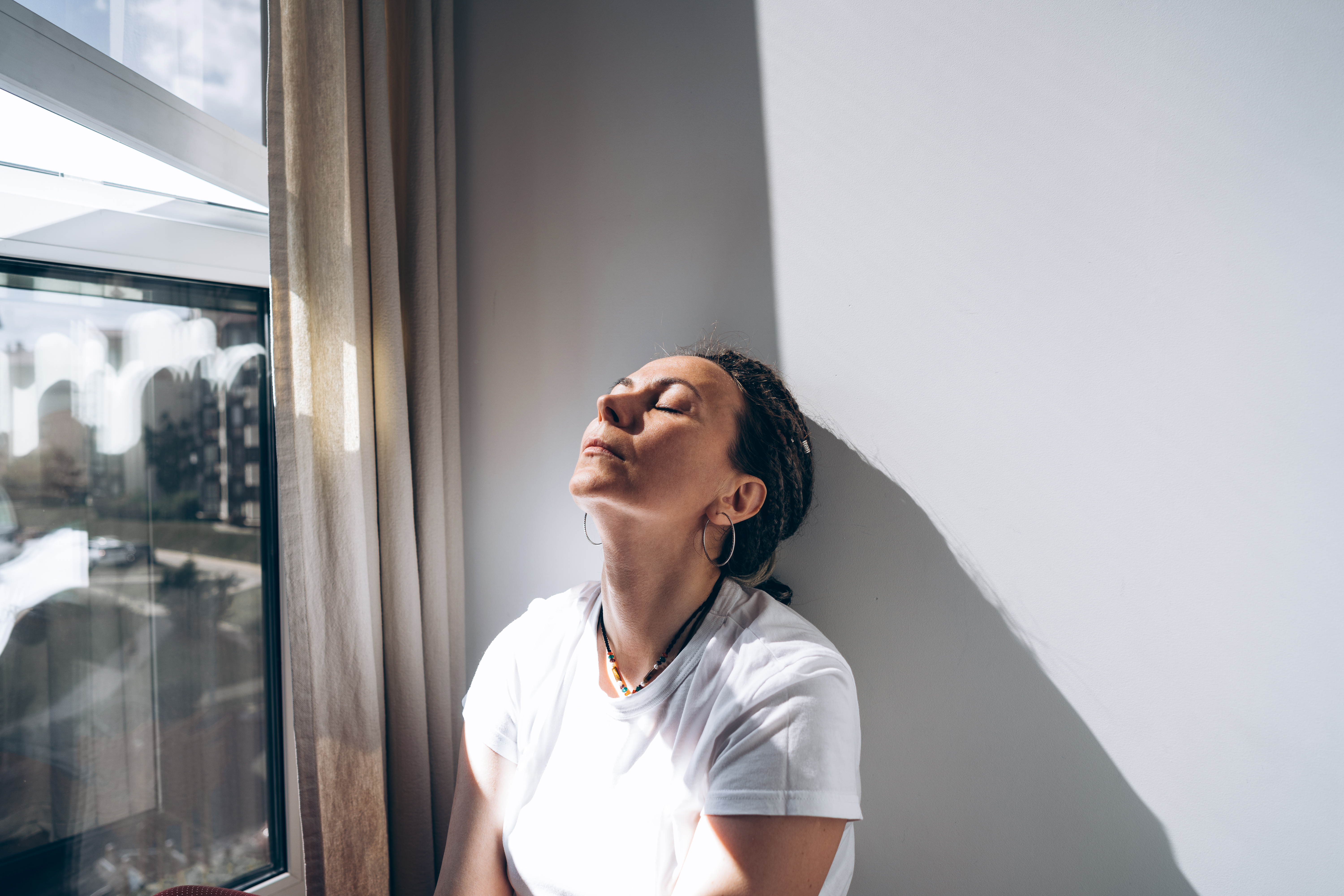 Portrait of a woman sitting by the window