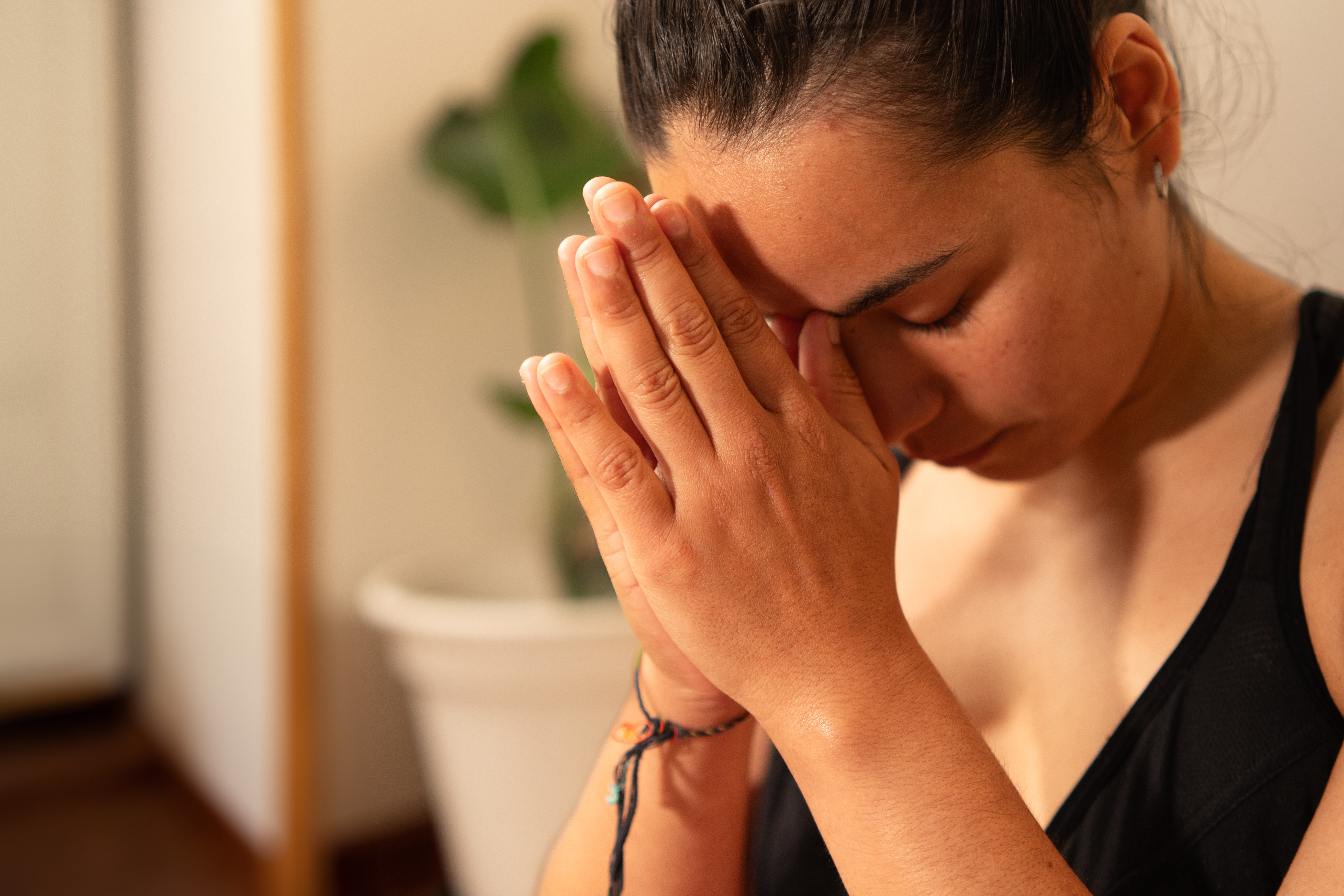 Woman meditating n the namaste posture